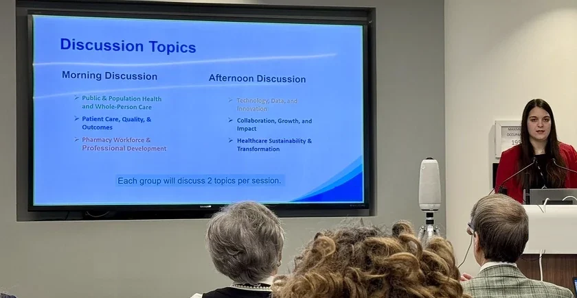 Georgia Galanou Luchen speaking at an ASHP lectern during a group discussion.